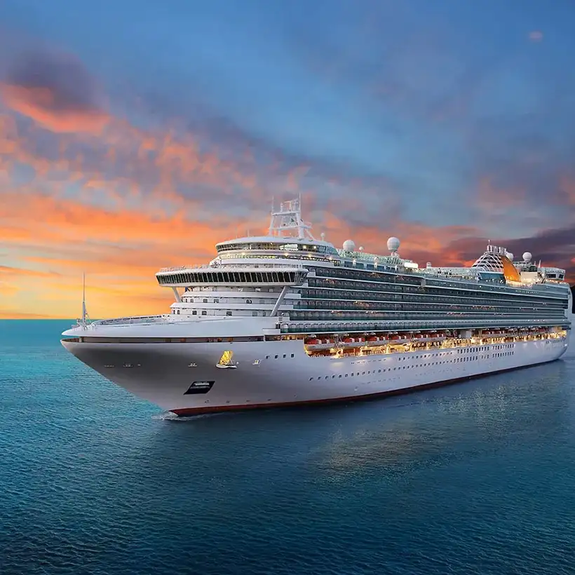 Cruise ship on an ocean at sunset